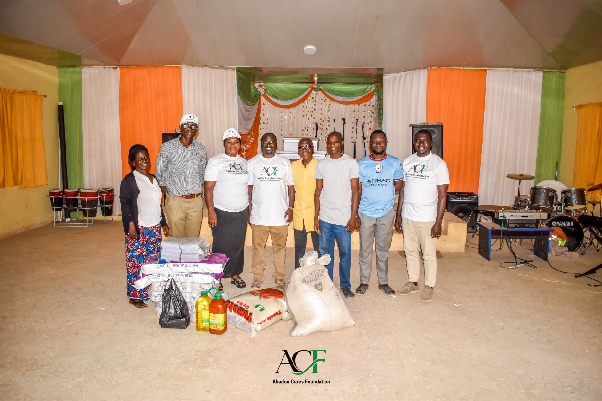 ACF team and caregivers with donated food items and supplies